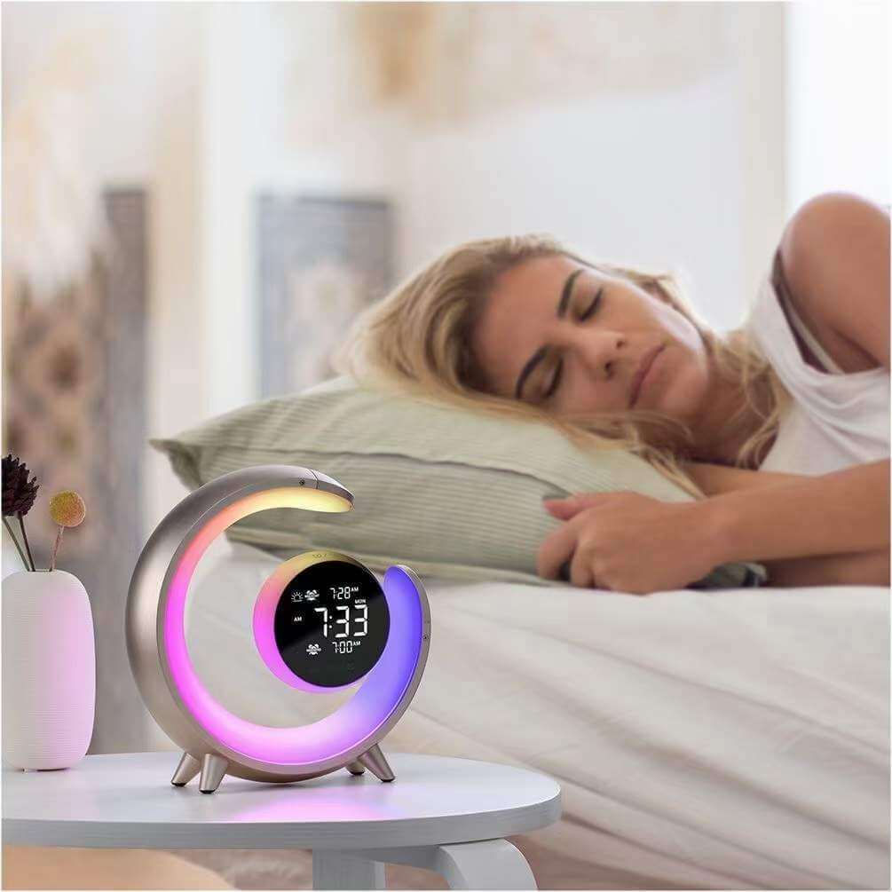 Royallure multifunctional night light with RGB colors and dual alarm clock next to a sleeping woman.
