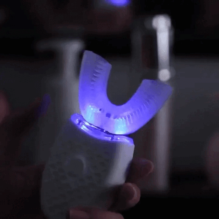 U-Shaped Ultrasonic Electric Toothbrush – 360° automatic deep cleaning with 48,000 rpm vibration. Features UV whitening, nano blue light, waterproof food-grade silicone, and one-touch 3-mode operation. Hands-free design for effortless oral care. Available in White, Pink, Blue, and Black.