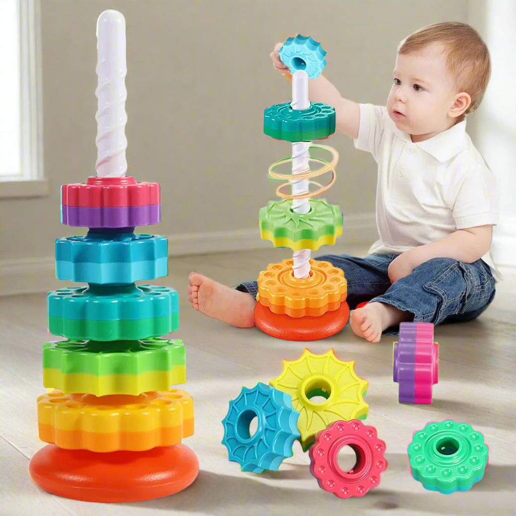 Rainbow-colored spiral stacking toy for toddlers with spinning discs, BPA-free ABS plastic, boosts motor skills and sensory play – educational gift for boys and girls.