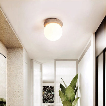 LuxRoyale Outdoor Wall Sconce Light with Natural Stone Base & Frosted Globe Shade