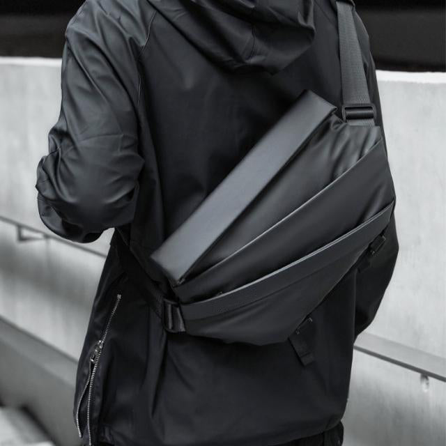 Men’s waterproof crossbody sling bag with anti-theft pockets, padded adjustable strap, hidden bottom pouch, and magnetic closure for everyday carry.