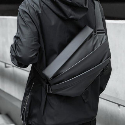 Men’s waterproof crossbody sling bag with anti-theft pockets, padded adjustable strap, hidden bottom pouch, and magnetic closure for everyday carry.