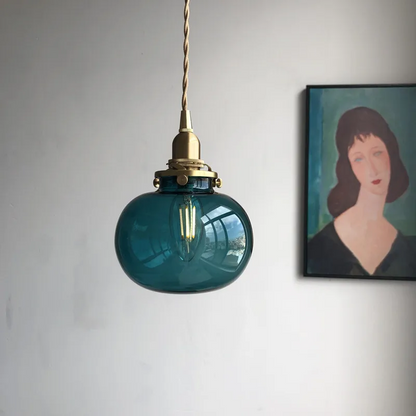 Lumora Hand-Blown Teal Glass Orb Pendant Light with Brushed Brass