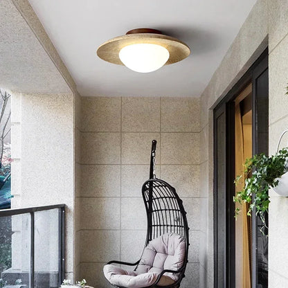 Lumora Sculptural Travertine Ceiling Light with Frosted Globe