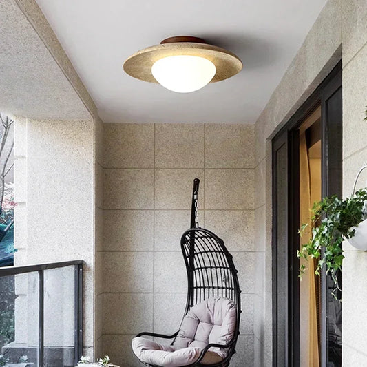 Lumora Sculptural Travertine Ceiling Light with Frosted Globe