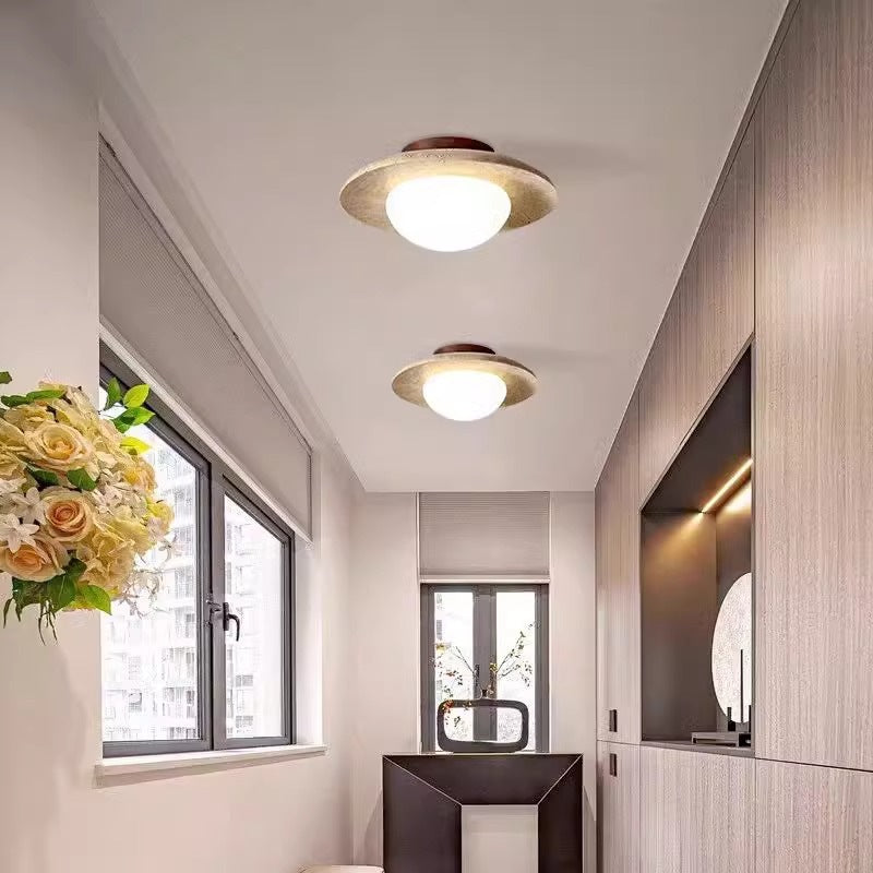 Lumora Sculptural Travertine Ceiling Light with Frosted Globe