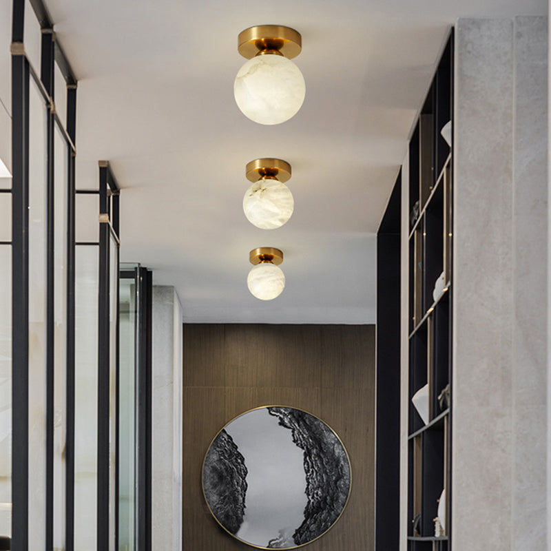 RoyaleGlow Brass & Marble Globe Flush Mount Ceiling Light