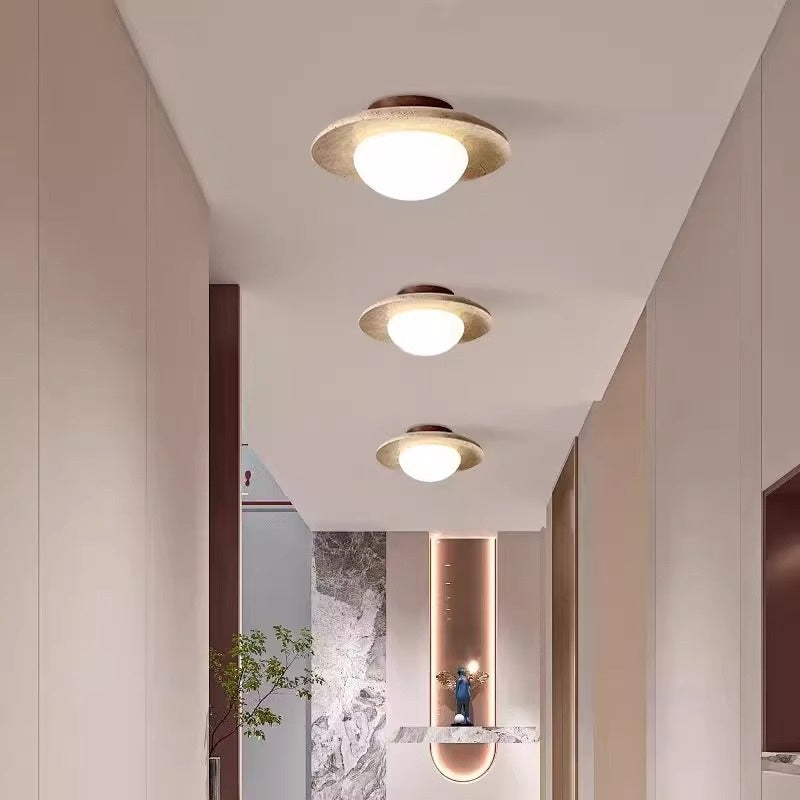 Lumora Sculptural Travertine Ceiling Light with Frosted Globe