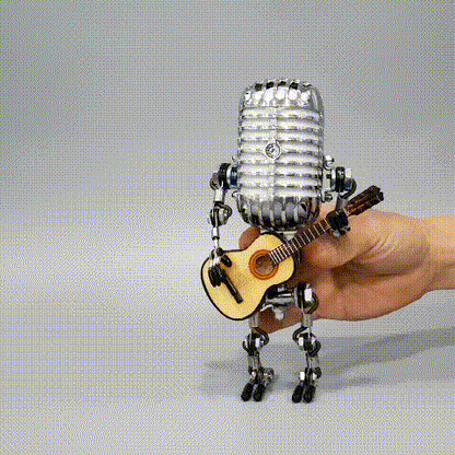 Handcrafted microphone robot lamp with adjustable joints and energy-saving LED light. Made from durable metal with a retro brass finish, perfect for music lovers. Includes a free guitar decoration.