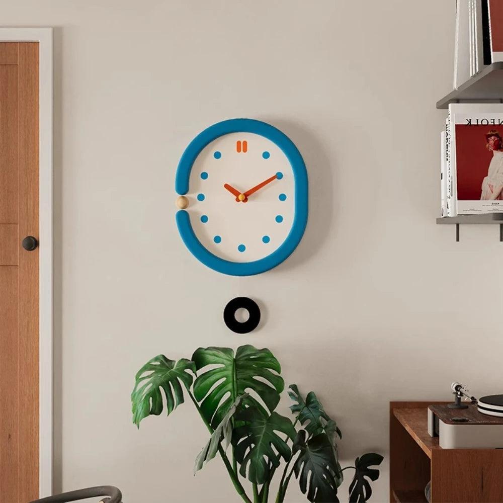 RoyaleGlow Minimalist Blue Oval Pendulum Wall Clock - Modern Aesthetic Home Decor-Royale Basic