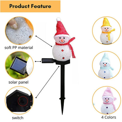 LED snowman solar garden stake lights illuminating a festive outdoor lawn with Christmas decorations.