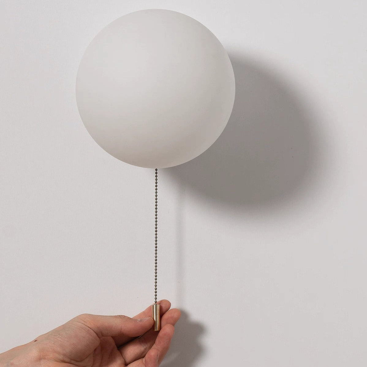 Rayvia Surface Mount Glass Globe Wall Sconce