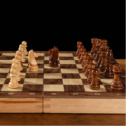 Wooden chessboard with pieces on a dark background