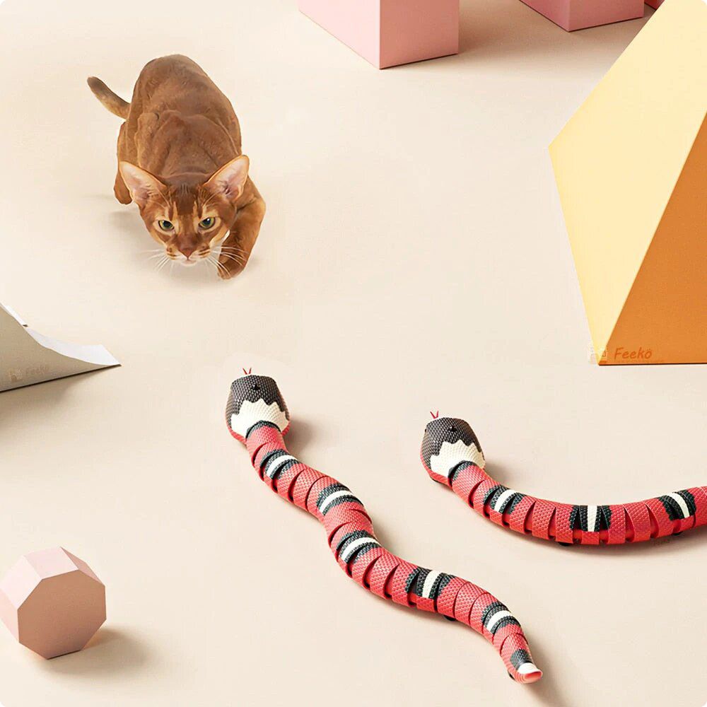 Realistic interactive snake toy for cats with USB charging, smart sensing, flicking tongue, and LED eyes – 16-inch durable ABS plastic design.