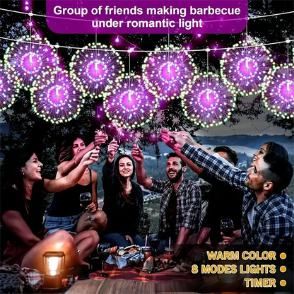 Hanging solar-powered firework lights with a vibrant display illuminating a backyard patio.