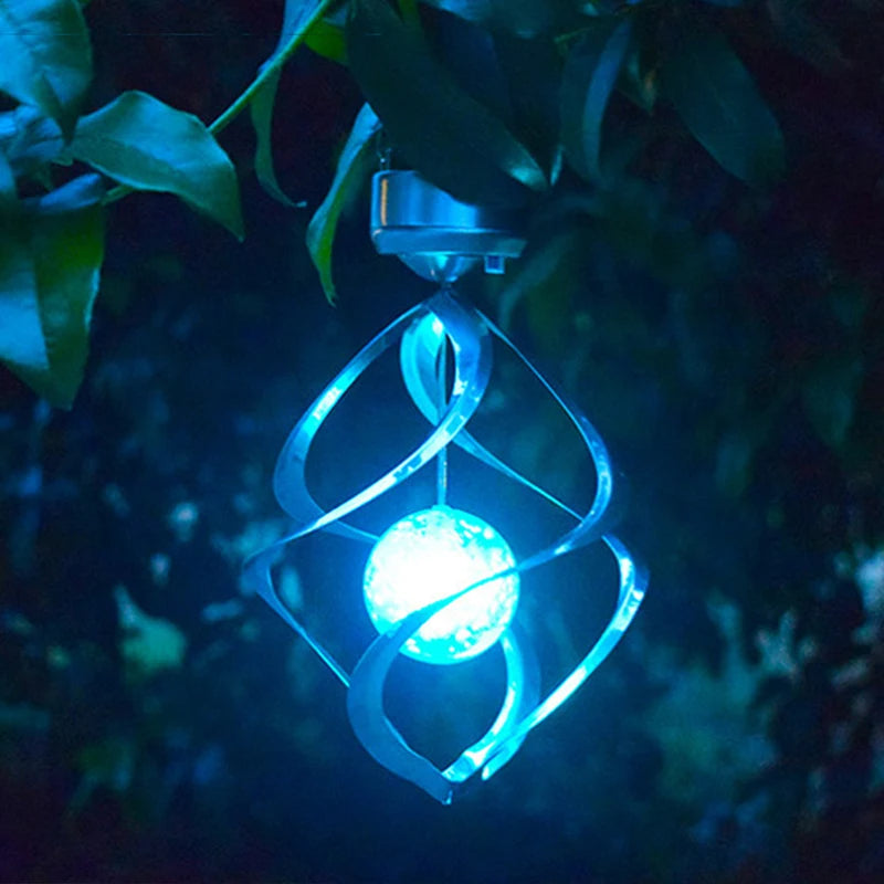 Solar-powered color-changing LED wind chime with spiral spinner design, weatherproof garden decor for patios, balconies, and outdoor spaces – elegant night light and soothing chime.