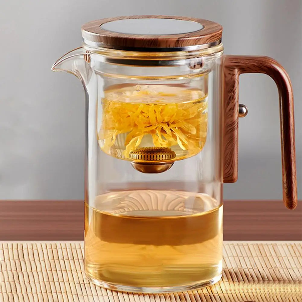 Elegant glass teapot with infuser, crafted from heat-resistant borosilicate glass. Features anti-scald wooden handle, drip-free spout, and innovative water separation technology for perfect tea brewing. Easy to clean and maintain.