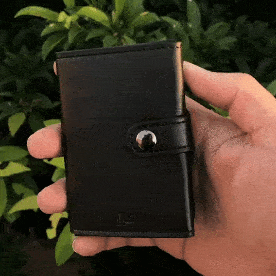 Slim RFID-blocking pop-up wallet holding up to 10 cards, minimalist design with secure aluminum case and quick-access button.