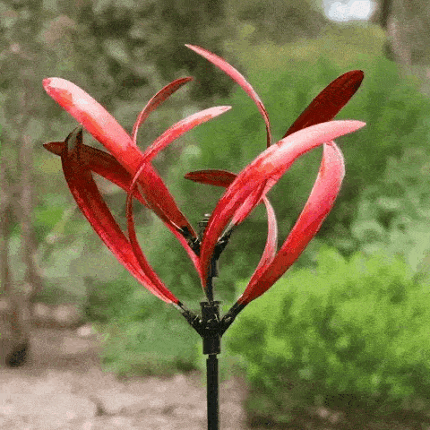 BreezeGlide Wind Spinner made of high-quality metal with a stylish, reflective finish, designed for outdoor garden and patio decor.