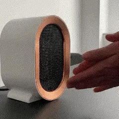 Compact ceramic electric heater with energy-efficient design, fast heating, safety switch, and timer – portable space heater for home or office use.