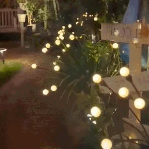 Solar-powered swaying firefly lights for garden décor – weather-resistant LED pathway lights with dusk-to-dawn sensor, soft warm flickering glow, and flexible PVC stems for a dancing effect.