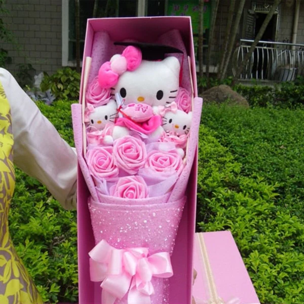 sanrio kitty plush stuffed bouquet with soap roses and graduation hats handmade floral arrangement gift for birthdays graduations or special occasions cute and ready to gift collectible kitty bouquet